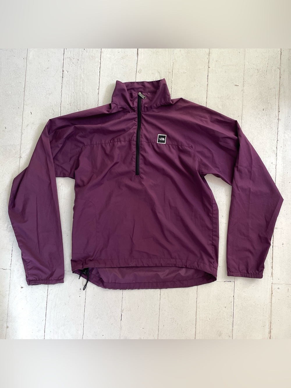 The North Face burgundy purple lightweight packable windbreaker jacket